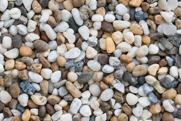 Flat lay of sea stones texture background. Abstract shape pattern from nature.