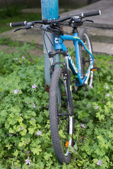 City bicycle parked on the street. 