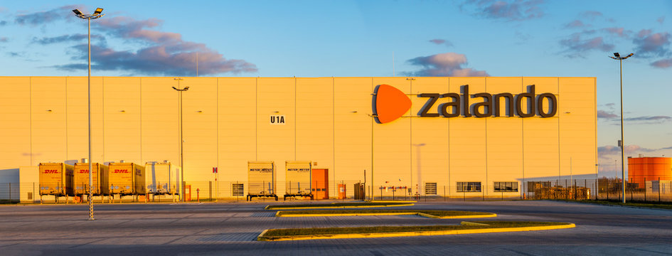Modern storage building at Zalando logistics center in Poland in the light of the setting sun