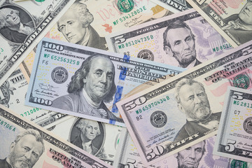 Flat lay of many US dollars bill banknote background. Concept of economy financial crisis in global world and USA. Central banking system of USA (FED) consider and control suitable interest rate.