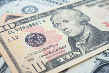 Portrait of American statesman Alexander Hamilton and Federal Reserve System (FED) seal macro detail on a ten dollar banknote or bill. Concept of central bank and USA or world economic financial.
