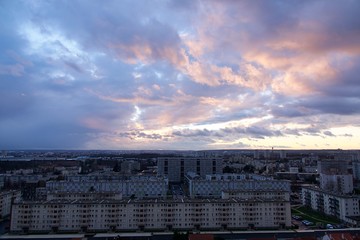 Panorama of Chevilly-Larue in France at sunset; dark and pink clouds above the city