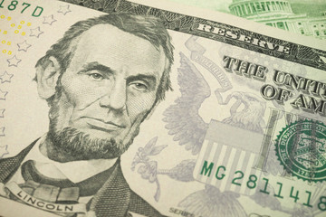 Portrait of  president Abraham Lincoln and Federal Reserve System (FED) seal macro detail on a...