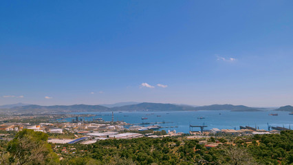 Obraz premium Aerial panoramic view of Lemos, Vouliagmeni, Greece under blue sky; Blue sky and beautiful city