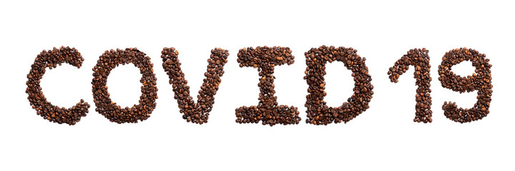 Inscription Covid 19 of the English alphabet  from freshly roasted cocoa beans on a white isolated background.Meal and medical  pattern.Sign  coronavirus from a photo of coffee beans