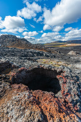 Beautiful colourful Icelandic landscape lava fields mountain geysers zigzag road and moss-covered...
