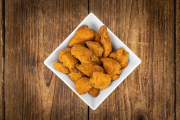 Homemade Chicken Nuggets on vintage background