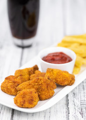 Homemade Chicken Nuggets on vintage background