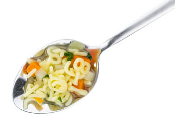 Alphabet Soup (selective focus) isolated on white background