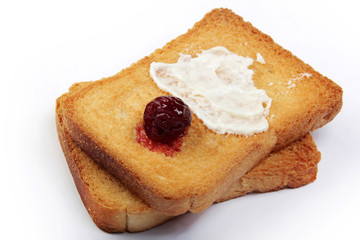 Fototapeta na wymiar butter and jam on toasted bread