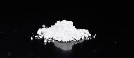 Dark plate with a portion of Cocaine