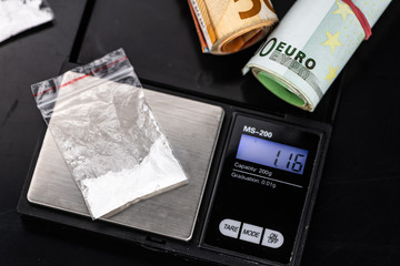 Dark plate with a portion of Cocaine