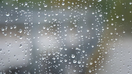 Raindrops on glass, glass texture with rain drops