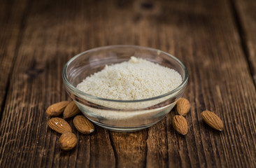 Portion of healthy Almond Flour (selective focus; close-up shot)