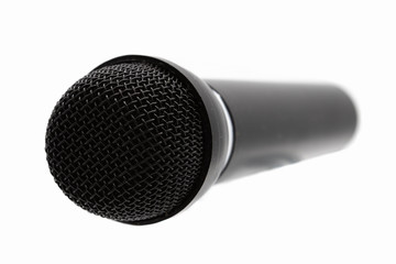 Black microphone isolated on a white background.