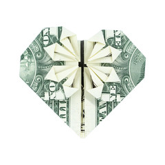 Close-up of origami heart of banknote. Origami made of a dollar bill isolated on white background