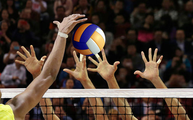 Volleyball spike blocking in front of  the net