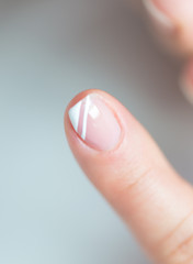 Close-up shot of a woman in manicure. Woman gets a manicure for nails