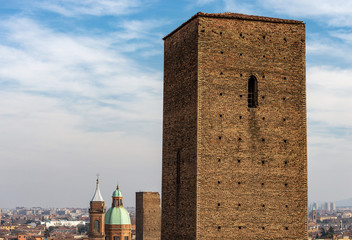 Bologna, closeup of the Azzoguidi tower (XII century), In the background the Garisenda tower and the Basilica of Santi Bartolomeo e Gaetano, Emilia-Romagna, Italy, Europe © Alberto Masnovo