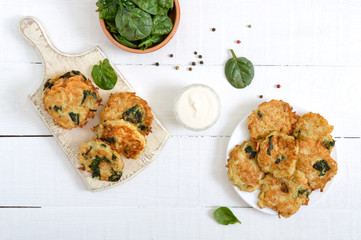 Pancakes with cabbage and spinach. Juicy vegetable cutlets with sour cream. Diet menu. Lenten dish. The top view