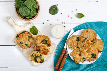 Pancakes with cabbage and spinach. Juicy vegetable cutlets with sour cream. Diet menu. Lenten dish. The top view