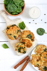 Pancakes with cabbage and spinach. Juicy vegetable cutlets with sour cream. Diet menu. Lenten dish. The top view