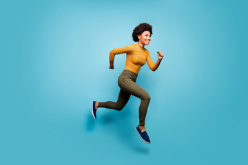 Full length body size view of nice lovely healthy cheerful active purposeful wavy-haired girl running season marathon isolated on bright vivid shine vibrant blue green teal turquoise color background