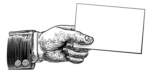 A hand holding business card or flyer frame message sign with copyspace