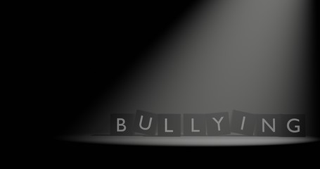 Bullying letter at cube in dark background with volumetric spotlight effect. 3D illustration with empty space.