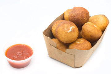 Fried Risotto Arancini stuffed with cheese, served with tomato sauce