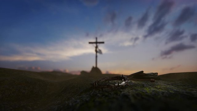 Crucifixion of Jesus Christ with thorn crown, nails, hammer and a rope against beautiful sunrise, 4K