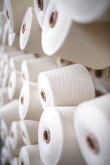 inside a textile factory, detailed image of yarn production and fabric production