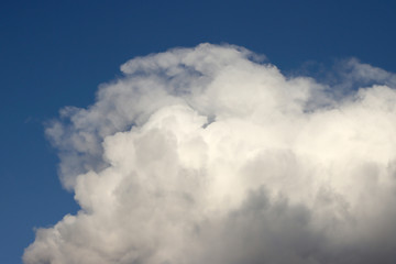 White, spring cloud in the blue sky.