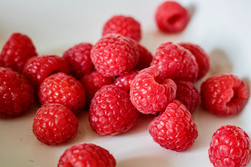 fresh raspberries on white background