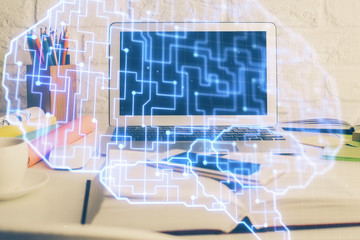 Double exposure of work space with computer and human brain drawing hologram. Brainstorm concept.