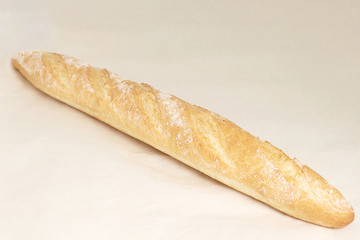 French baguette, an assortment of baked goods. Closeup on a light background