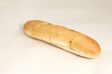 A loaf of cumin, an assortment of bakery and bakery. Closeup on a light background