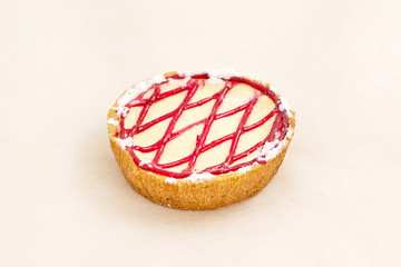 Cake basket with jam assortment of bakery and bread products. Closeup on a light background
