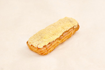 Eclair cake, delicious pastries closeup on a light background