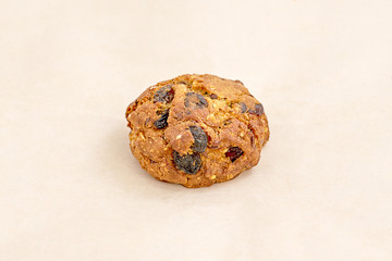 Cupcake with raisins and nuts. Range of bakery and confectionery. Closeup on a light background