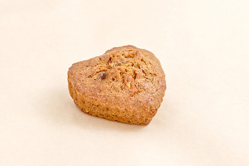 Fresh pastries, cake in the shape of a heart. The assortment of bakery and bakery. Closeup on a light background