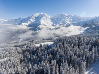 Fototapeta na wymiar Photographie aérienne de la station de ski de Saint Gervais Mont Blanc sous la neige 