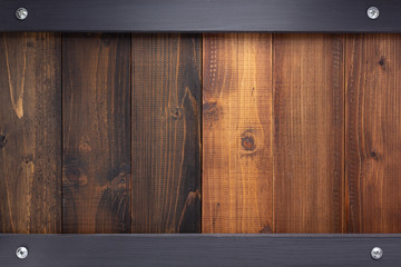 wooden brown and black board with screws