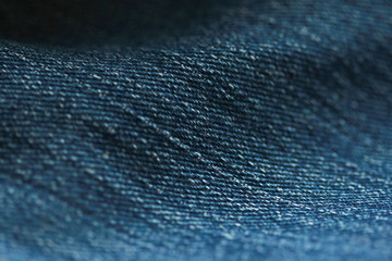 Jeans denim texture close up , focus only one point , soft blured background wallpaper