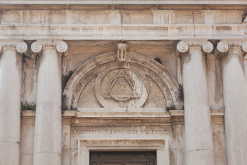 Obraz premium eye sign inside triangle on building of Church of St. Magdalena, Venice, Italy