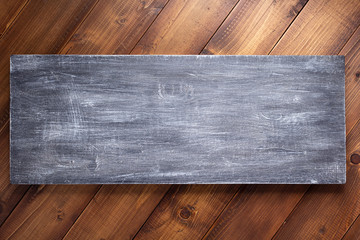 nameplate or wall sign at  wooden background texture