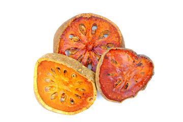 Dried bael fruit slices isolate on white background.