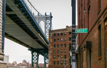 Naklejka premium Water Street and Manhattan Bridge in Brooklyn, New York, USA