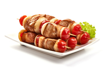 Grilled Shish kebab. Skewers with pieces of roasted barbecue, isolated on white background