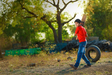 Rural Indian Child Playing Cricket